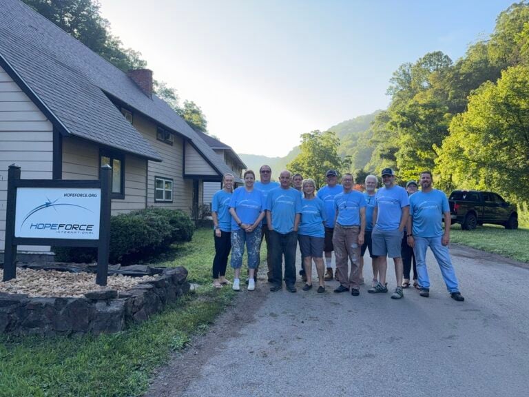 A Hope Force Reservist team stands on Caretta Road in War, WV in front of the Hope Force team house.