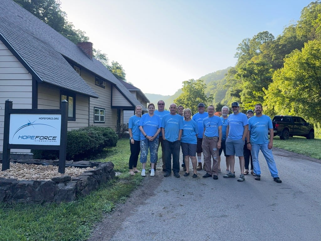 A Hope Force Reservist team stands on Caretta Road in War, WV in front of the Hope Force team house.
